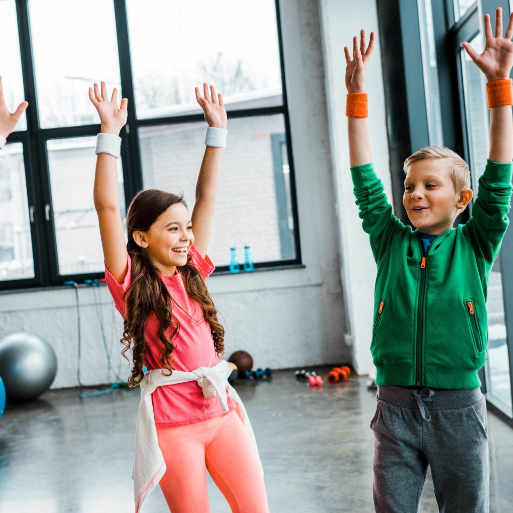 group-of-laughing-kids-standing-in-gym-with-hands-2024-11-17-14-31-03-utc-min
