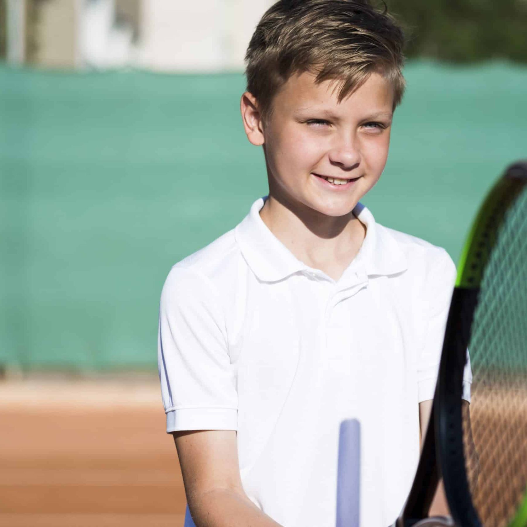 medium-shot-kid-playing-tennis-min