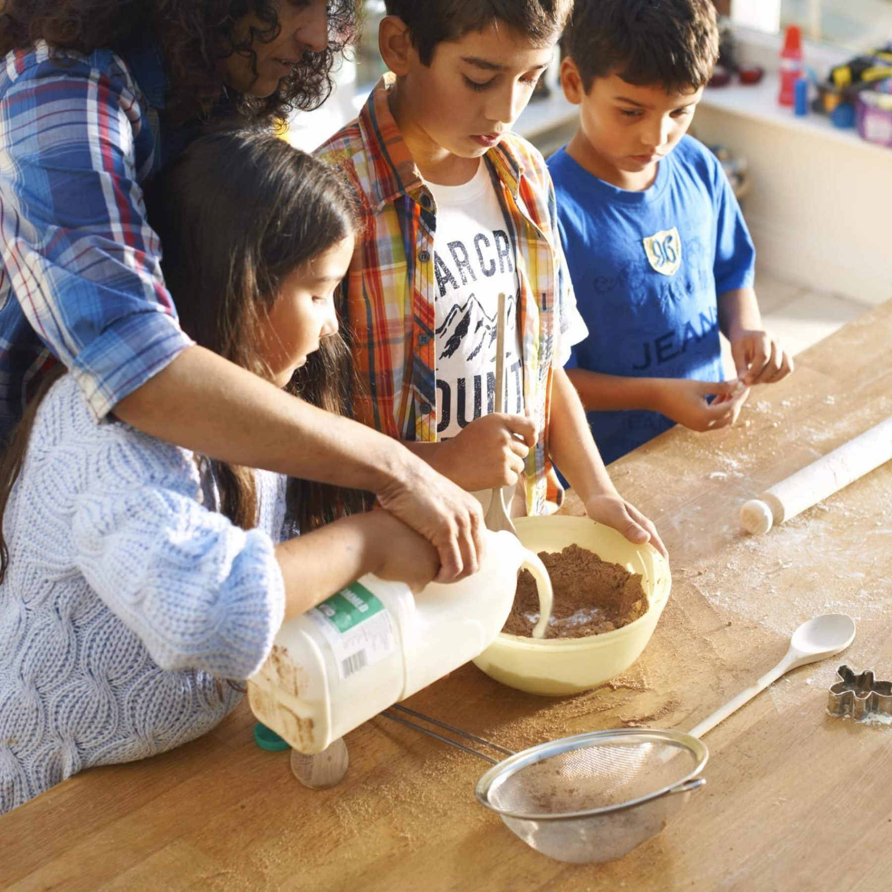 mother-and-children-baking-in-kitchen-2024-10-22-12-08-27-utc-min