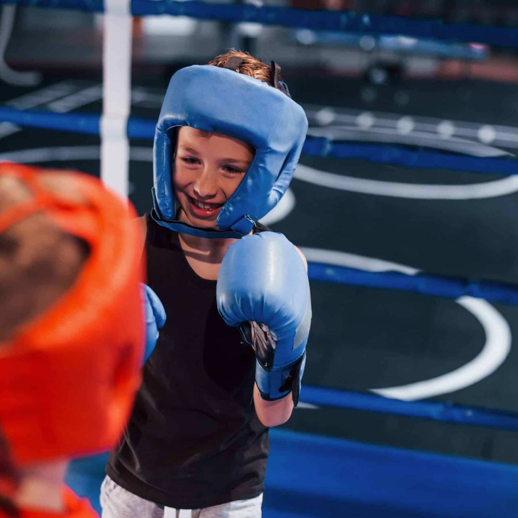 two-boys-in-protective-equipment-have-sparring-and-2023-11-27-05-06-44-utc-min